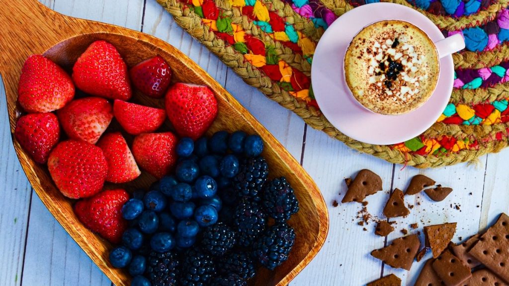 a bowl of strawberries, raspberries, blueberries, strawberries,
